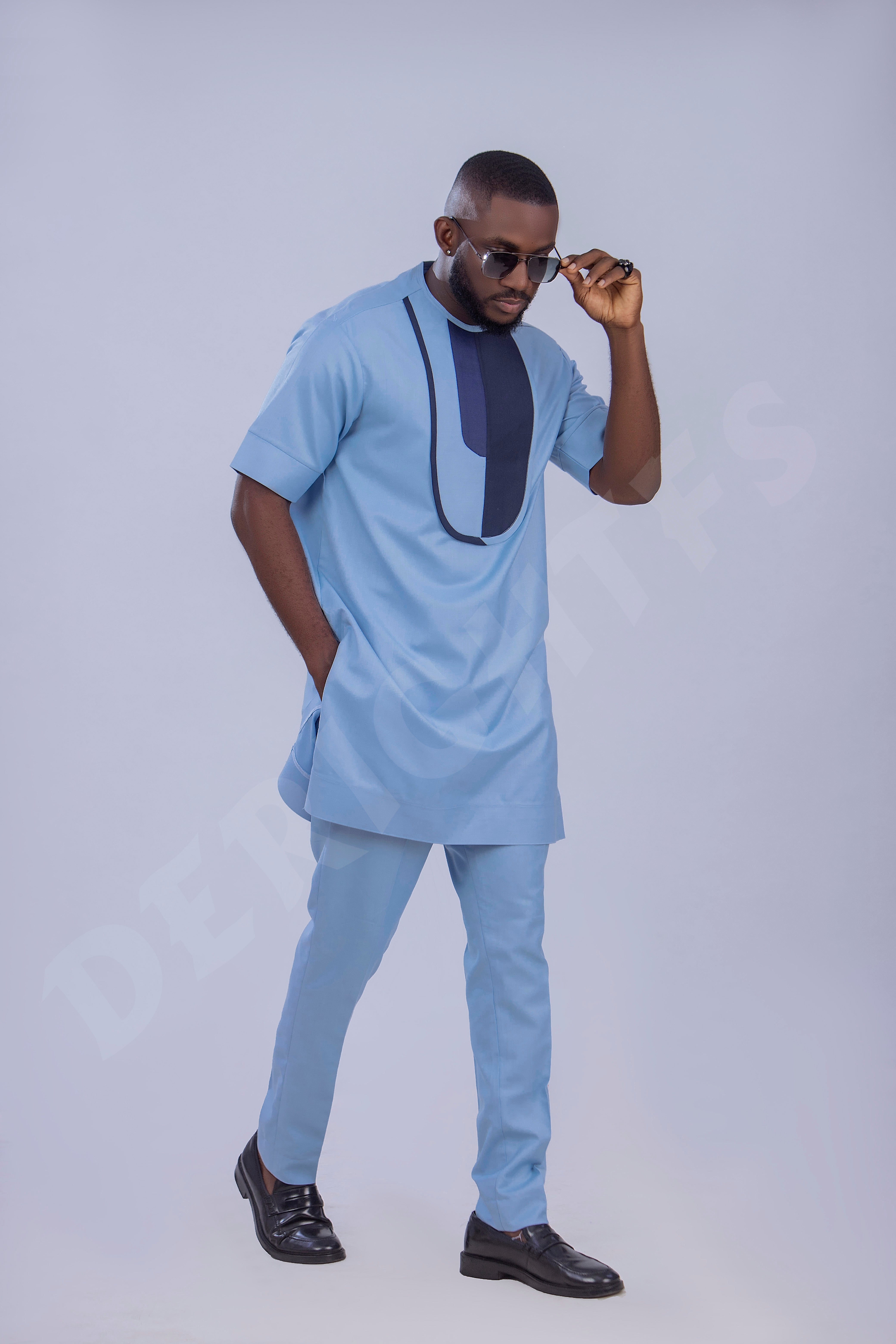 Stylish Light Blue Men's Outfit with Unique Navy Blue Accents