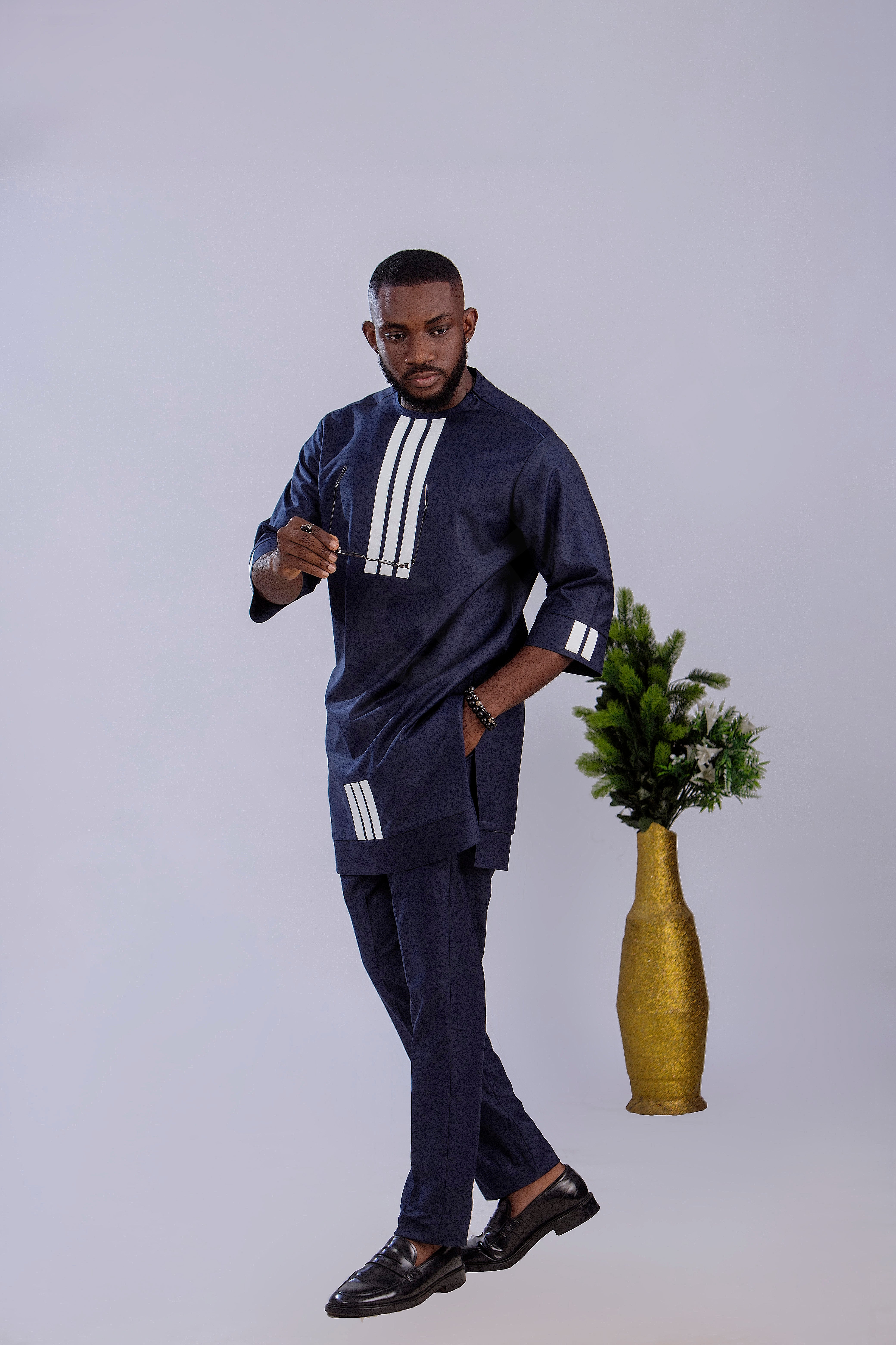 Navy Blue Men's Traditional Outfit with Modern White Accents