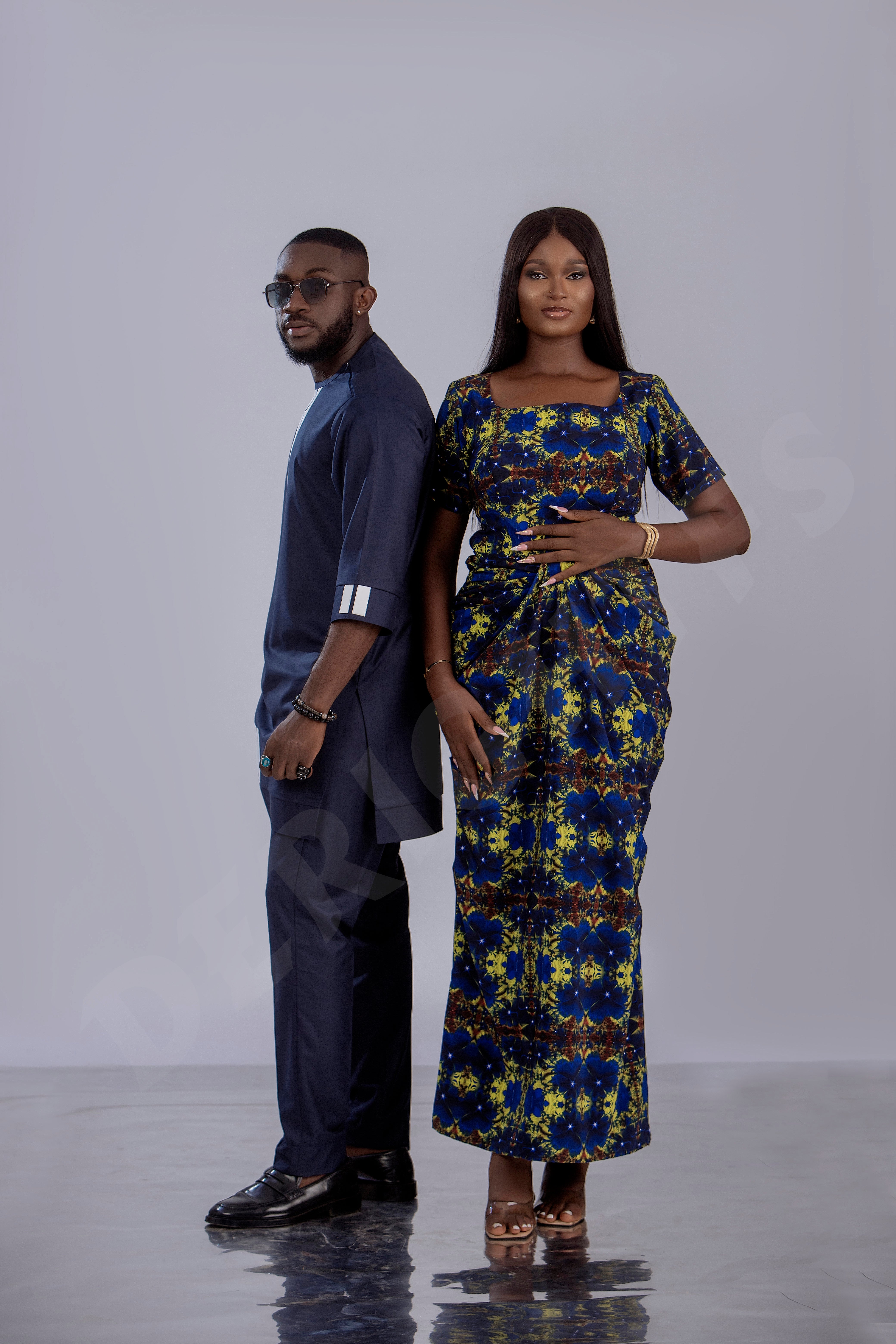 Navy Blue Men's Traditional Outfit with Modern White Accents