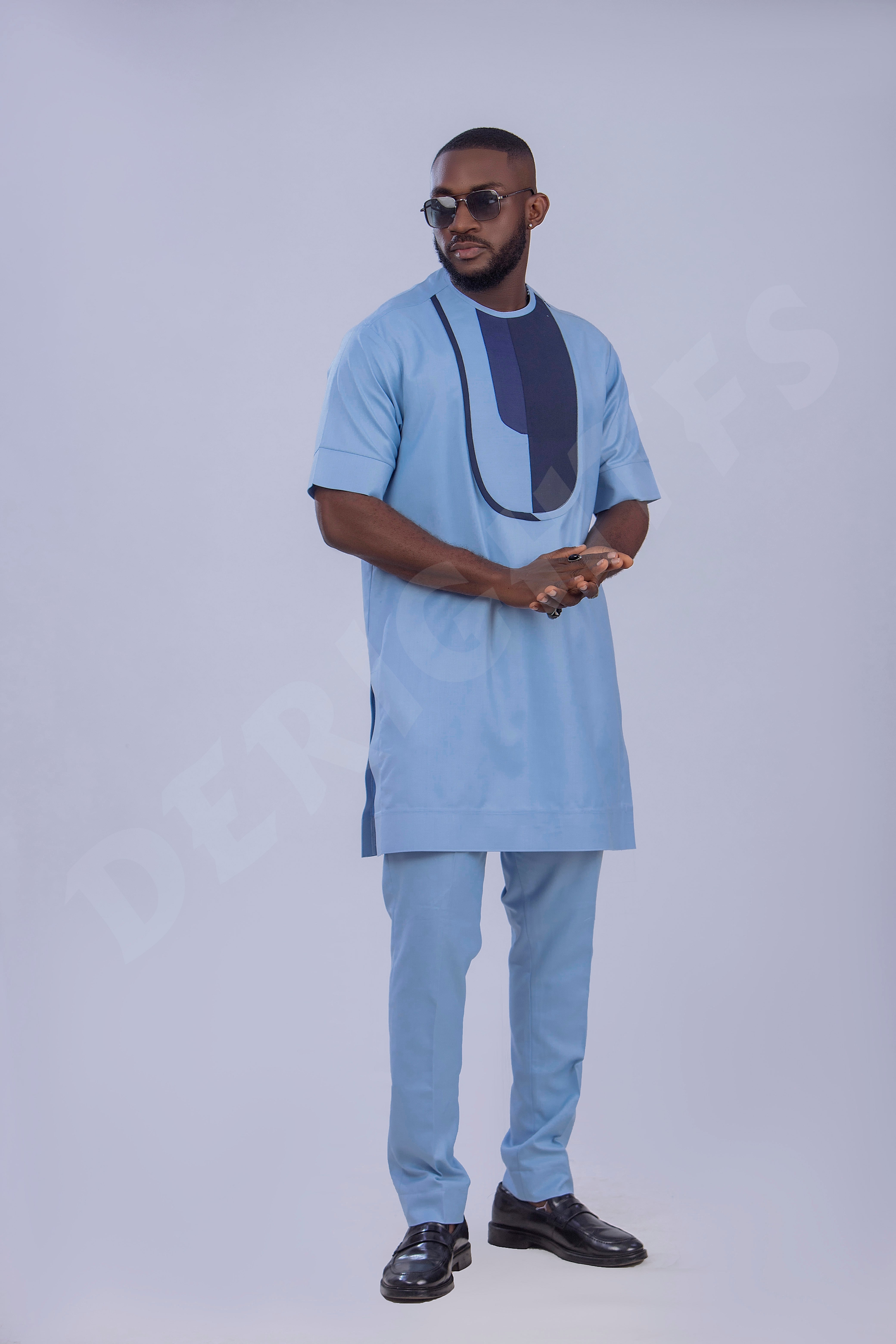 Stylish Light Blue Men's Outfit with Unique Navy Blue Accents