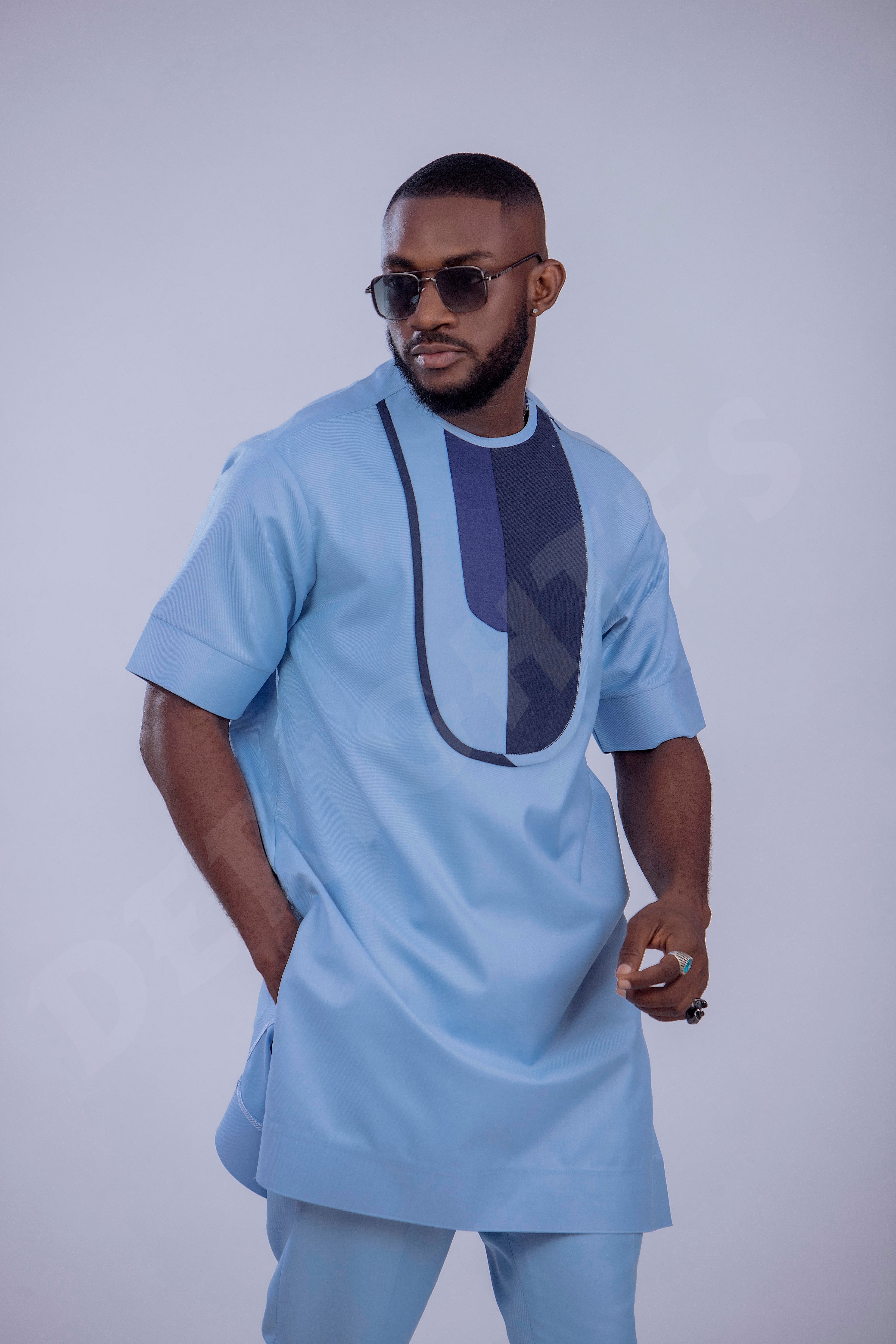 Stylish Light Blue Men's Outfit with Unique Navy Blue Accents